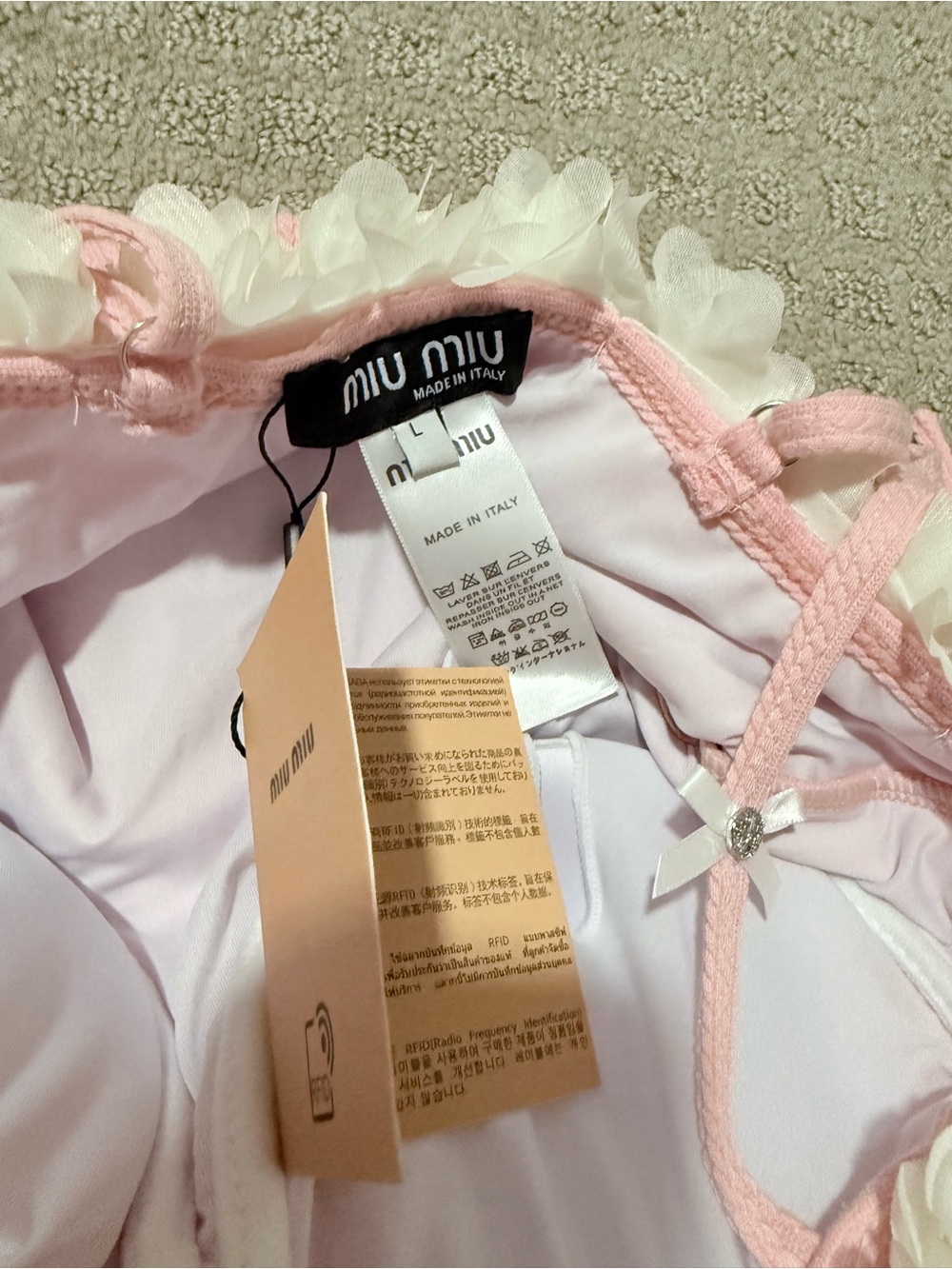 Miu Miu Pink Ribbed One-Piece with White Floral Trim and Ruffle Hem - Picture 2 of 4